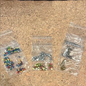 Variety of crafting fasteners and embellishments.